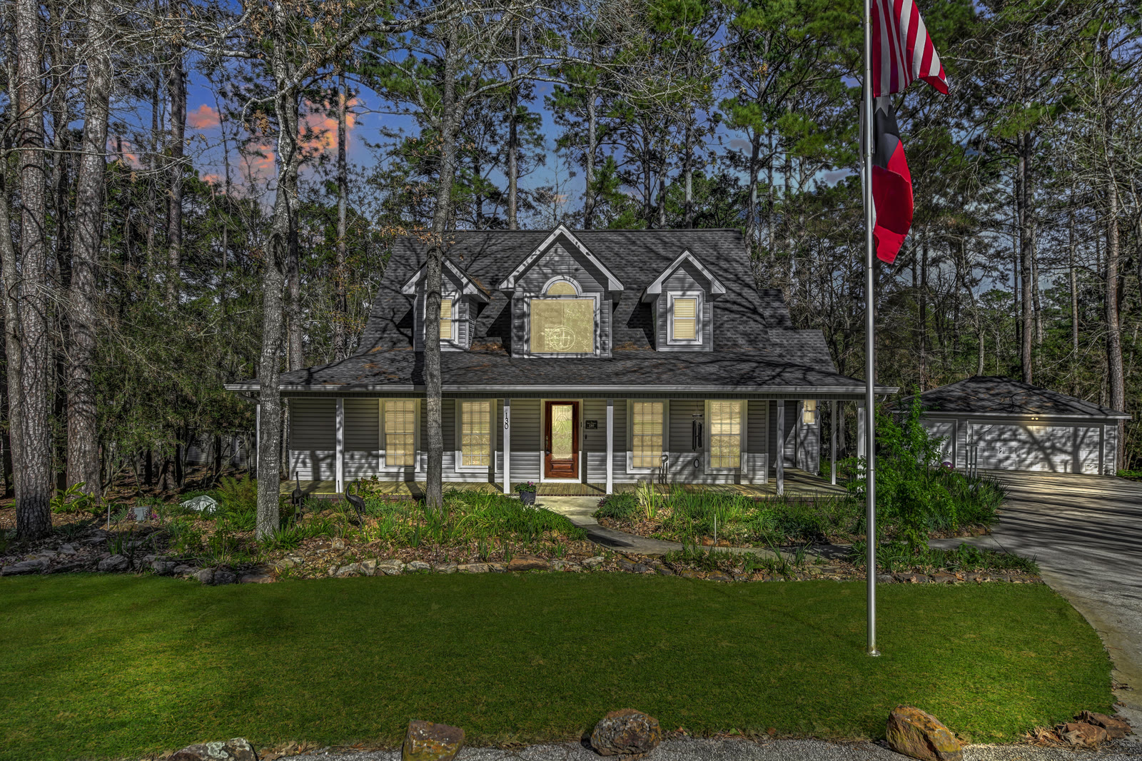 Wooded home exterior photographed in the evening